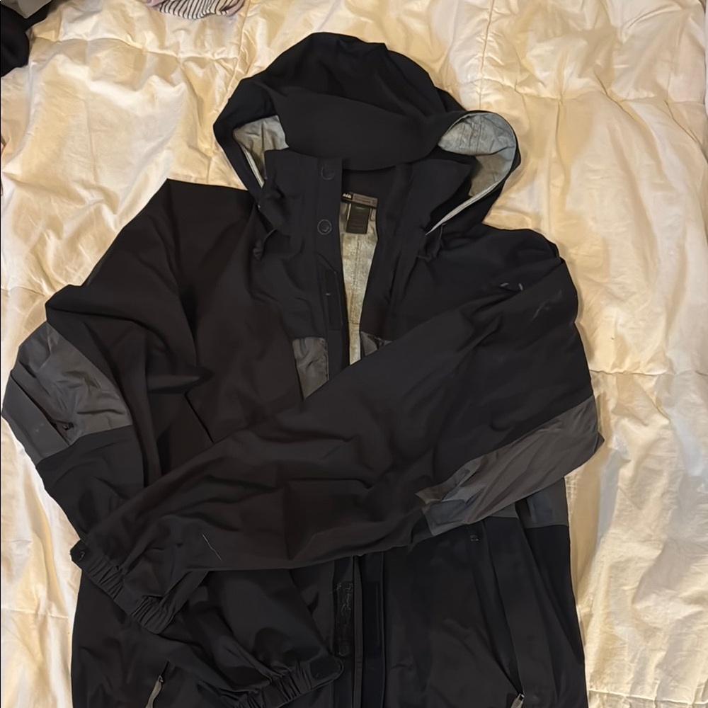 REI Black and Gray Hooded Raincoat Weather-Resistant Design